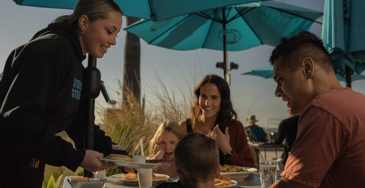 Friends and family enjoying a meal at Good Stuff