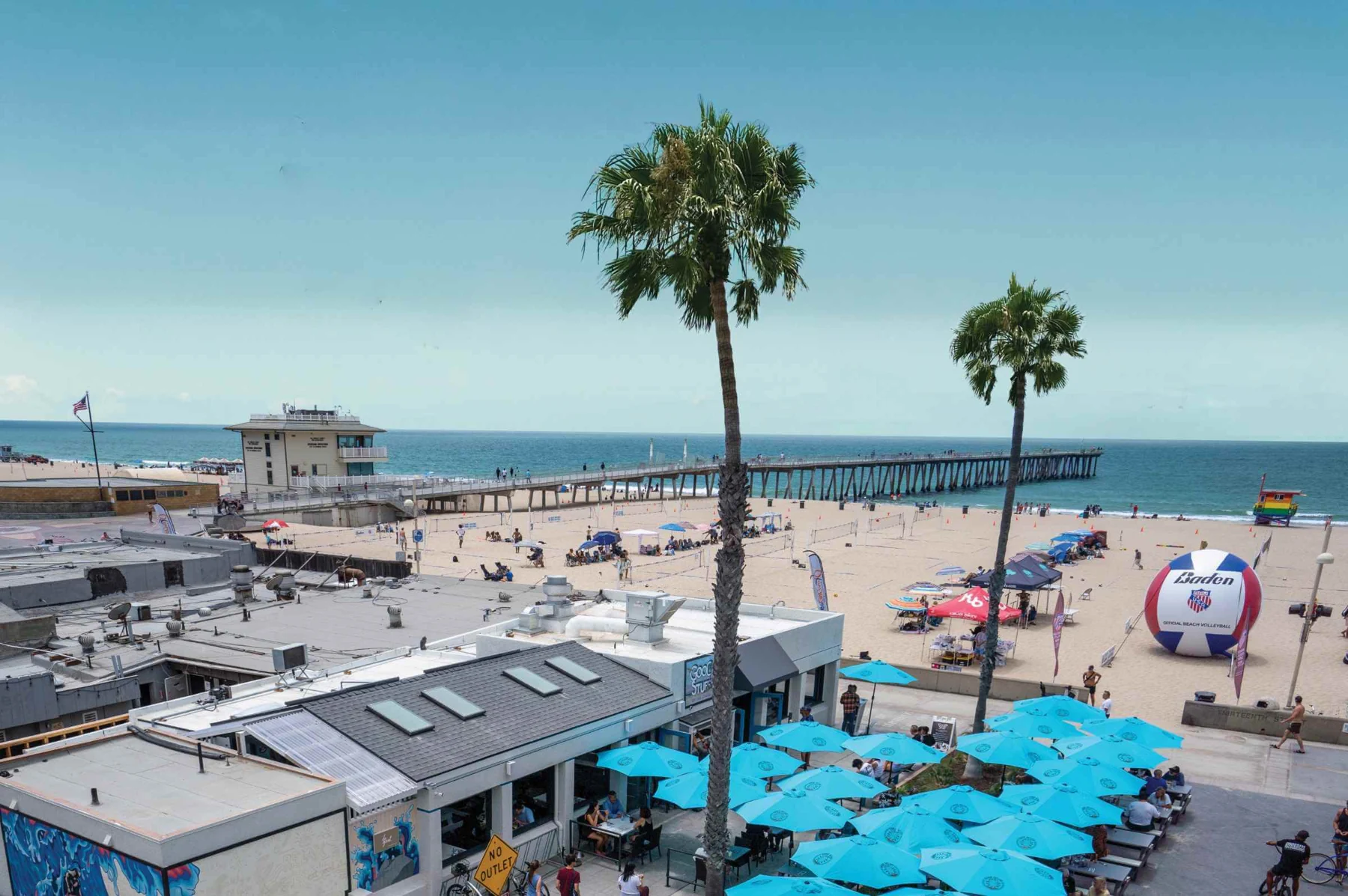 Good Stuff’s turquoise patio umbrellas beside the beach and Hermosa Pier