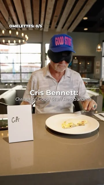 Cris tries an omelette while wearing a blindfold